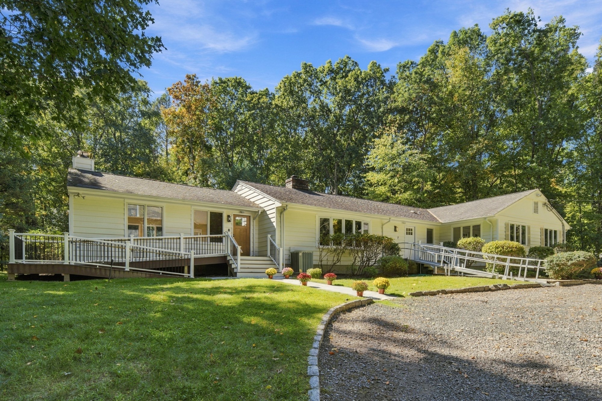 The Fox Hill Road home and driveway surrounded by trees
